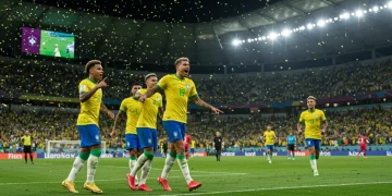 Jogadores brasileiros comemorando um gol com grande êxtase em um estádio lotado.
